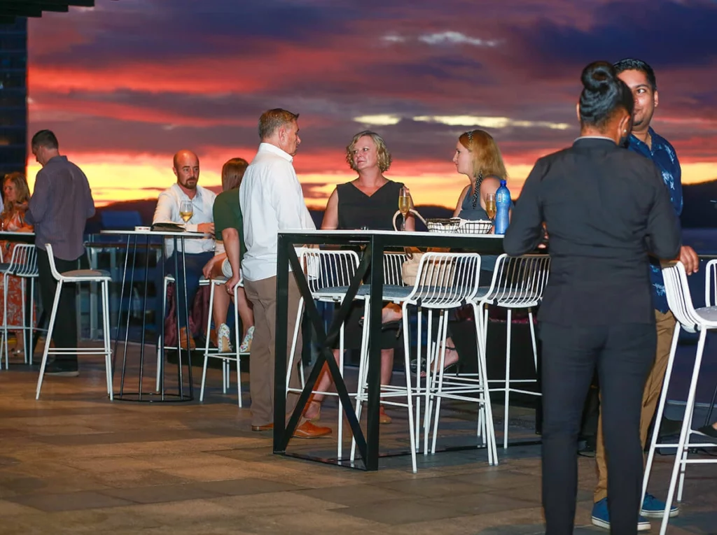 Guests on Port Terrace Restaurant & Bar at sunset